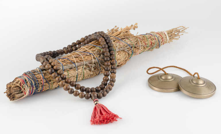 Prayer beads and Tibetan Buddhist meditation bells © Reid Dalland | Dreamstime.com